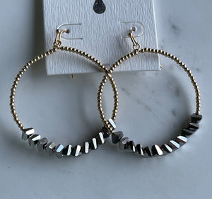 Gold hoops with grey crystal earrings